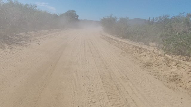 LOS CABOS BCS MEXICO-2022: Vehicle Driving on Dusty Desert Road