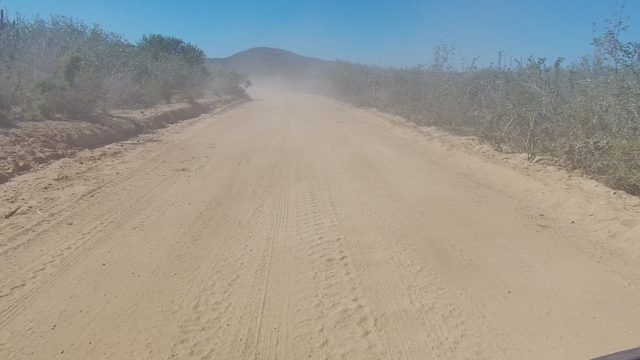 LOS CABOS BCS MEXICO-2022: Vehicle Traveling on Dusty Desert Road