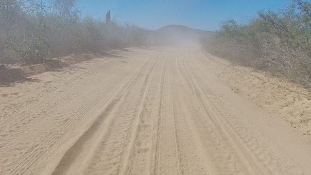 LOS CABOS BCS MEXICO-2022: Dusty Unpaved Road in Arid Desert Landscape