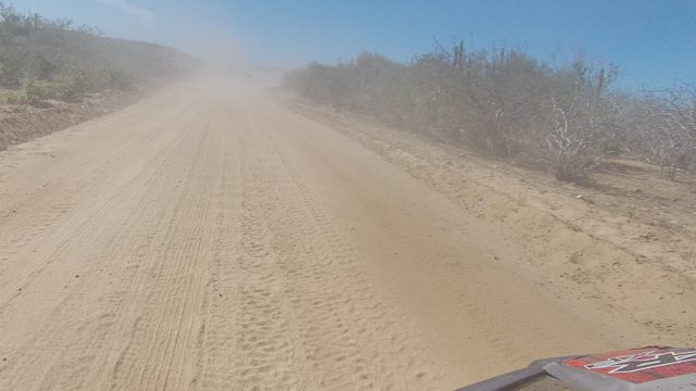 LOS CABOS BCS MEXICO-2022: Vehicle Traveling on Dusty Desert Road