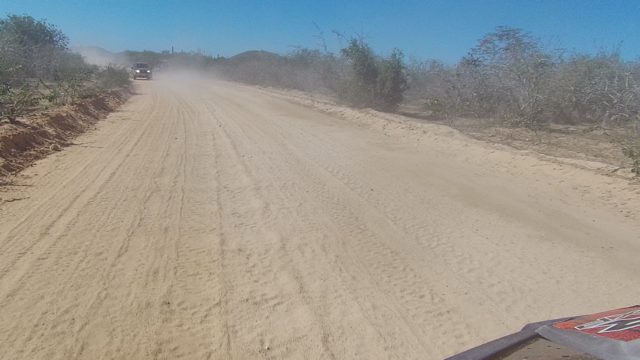 LOS CABOS BCS MEXICO-2022: Dusty Dirt Road with Vehicle Ahead