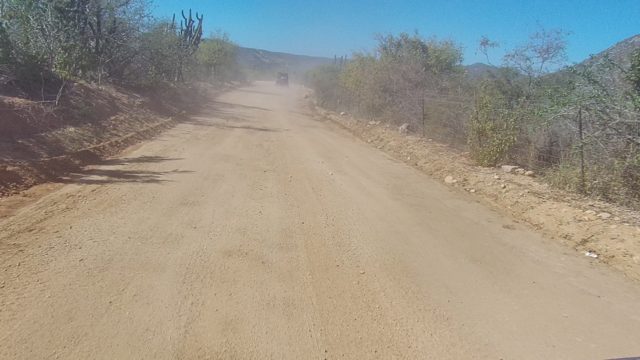LOS CABOS BCS MEXICO-2022: Vehicle Kicking Up Dust on Desert Dirt Road