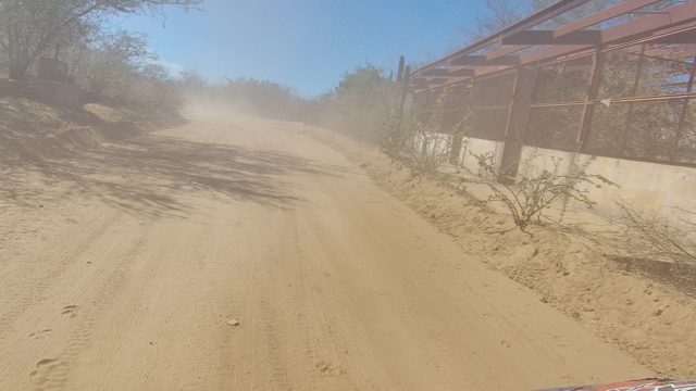 LOS CABOS BCS MEXICO-2022: Vehicle Driving on Dusty Desert Road