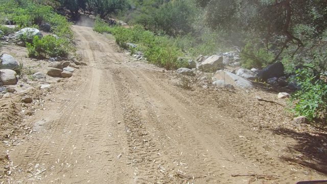 LOS CABOS BCS MEXICO-2022: Vehicle Moving on a Dusty Mountain Dirt Road