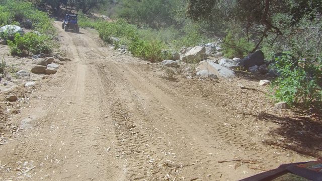 LOS CABOS BCS MEXICO-2022: Off-Road Vehicles Traveling on a Dusty Mountain Trail