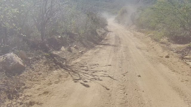 LOS CABOS BCS MEXICO-2022: Vehicle Driving on a Dusty Rural Dirt Road