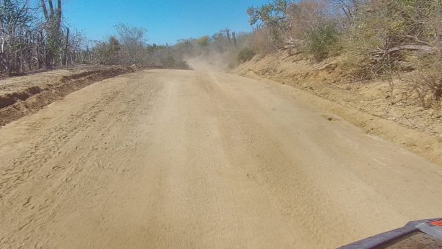 LOS CABOS BCS MEXICO-2022: Vehicle Traveling on Arid Sandy Road