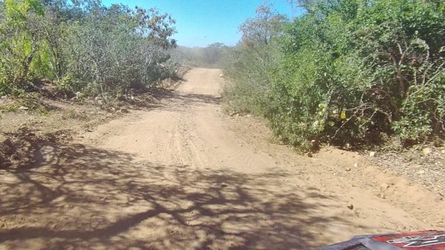 LOS CABOS BCS MEXICO-2022: Vehicle Traveling on a Sandy Dirt Road Through Arid Terrain