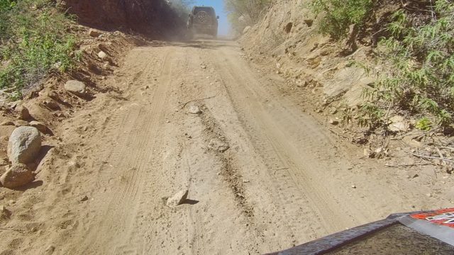 LOS CABOS BCS MEXICO-2022: Car Driving on Narrow Dusty Mountain Road