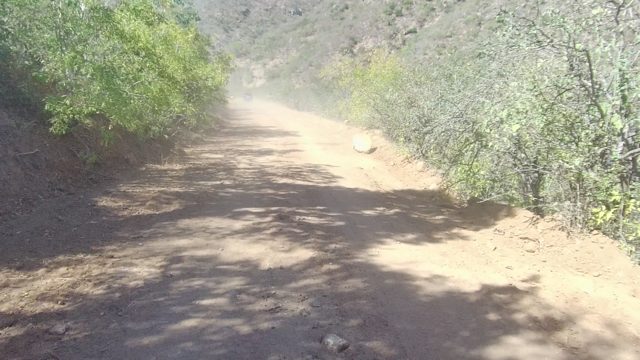 LOS CABOS BCS MEXICO-2022: Vehicle Traveling on Dusty Mountain Dirt Road