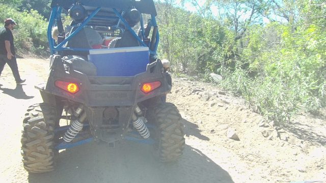 LOS CABOS BCS MEXICO-2022: Person Walking Past Blue Off-road Vehicle on Dirt Path