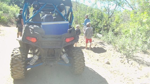 LOS CABOS BCS MEXICO-2022: People Moving Near Blue Off-Road Vehicle