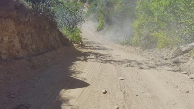 LOS CABOS BCS MEXICO-2022: Dusty Dirt Road with Vehicle in Motion