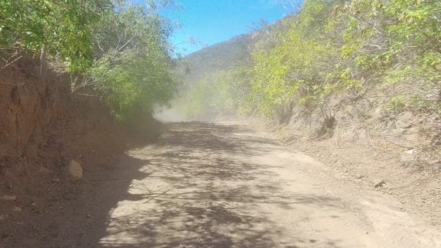 LOS CABOS BCS MEXICO-2022: Dirt Road Winding Through Mountainous Landscape