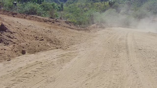 LOS CABOS BCS MEXICO-2022: Dusty Dirt Road with Eroding Slope and Fence