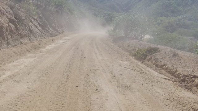 LOS CABOS BCS MEXICO-2022: Dusty Mountain Road with Moving Vehicle
