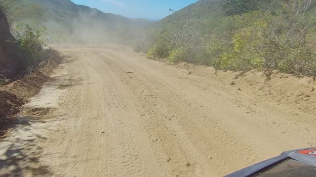 LOS CABOS BCS MEXICO-2022: Vehicle Traveling on a Dusty Mountain Dirt Road