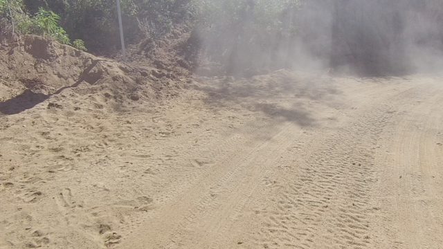LOS CABOS BCS MEXICO-2022: Dust Cloud From Vehicle on Unpaved Road