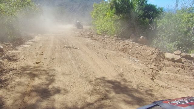 LOS CABOS BCS MEXICO-2022: Dusty Mountain Dirt Road with Moving Vehicle
