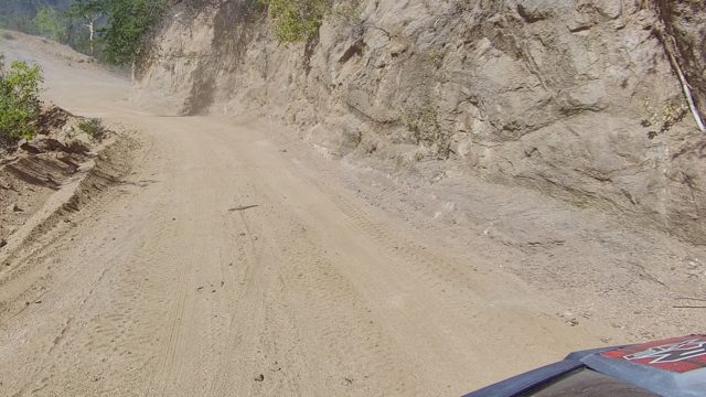 LOS CABOS BCS MEXICO-2022: Vehicle Navigating Narrow Dirt Road Through Rocky Terrain