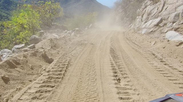LOS CABOS BCS MEXICO-2022: Vehicle Driving on Dusty Mountain Dirt Road