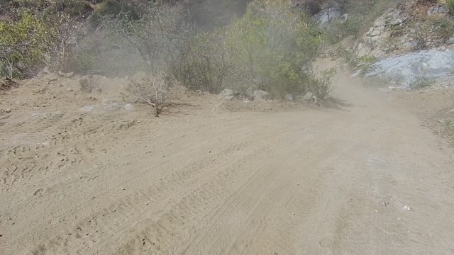 LOS CABOS BCS MEXICO-2022: Vehicle Driving on Dusty Mountain Dirt Road