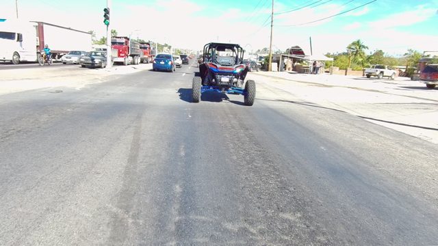 LOS CABOS BCS MEXICO-2022: Blue UTV Driving on a Busy Urban Road