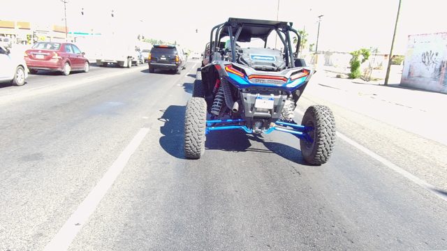 LOS CABOS BCS MEXICO-2022: Blue and Red UTV Stationary on a Multi-lane Road