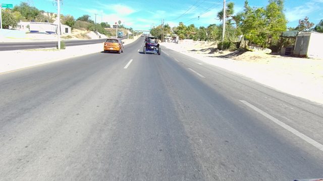 LOS CABOS BCS MEXICO-2022: Vehicles Traveling on a Two-lane Road with Sandy Shoulder
