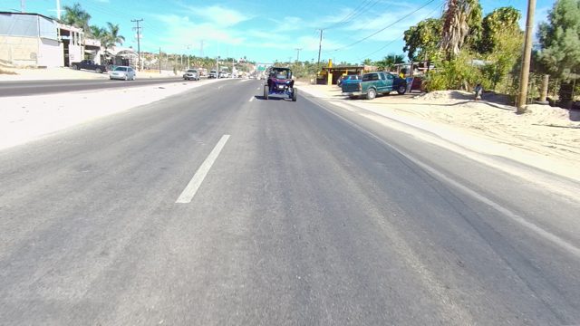 LOS CABOS BCS MEXICO-2022: Paved Road with Moving Cart and Passing Vehicles