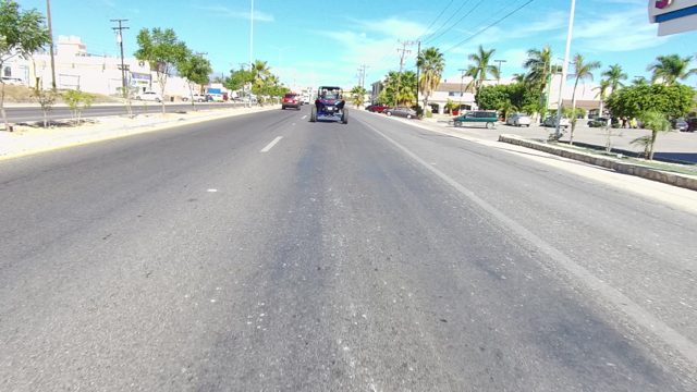 LOS CABOS BCS MEXICO-2022: Sunny Urban Street with Moving Vehicle