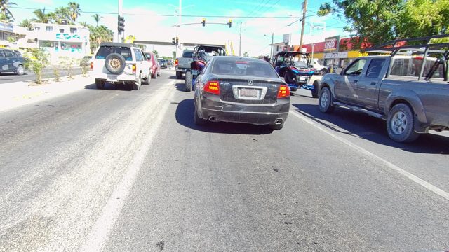 LOS CABOS BCS MEXICO-2022: Vehicles Stopped at a Traffic Light on a City Road