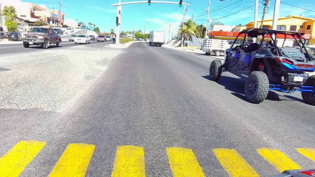 LOS CABOS BCS MEXICO-2022: Car Driving Through Urban Intersection with Traffic
