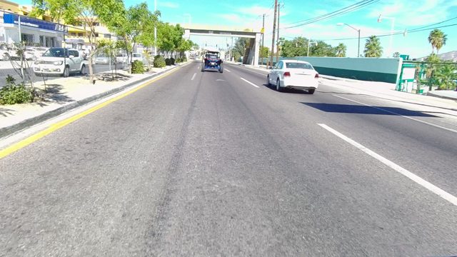 LOS CABOS BCS MEXICO-2022: Car Driving Under Overpass on Urban Road