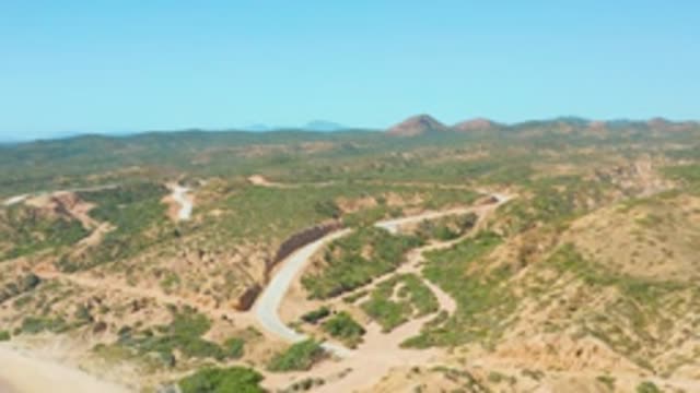 EL TULE LOS CABOS BCS MEXICO-2022: Winding Road Through Arid and Green Hills