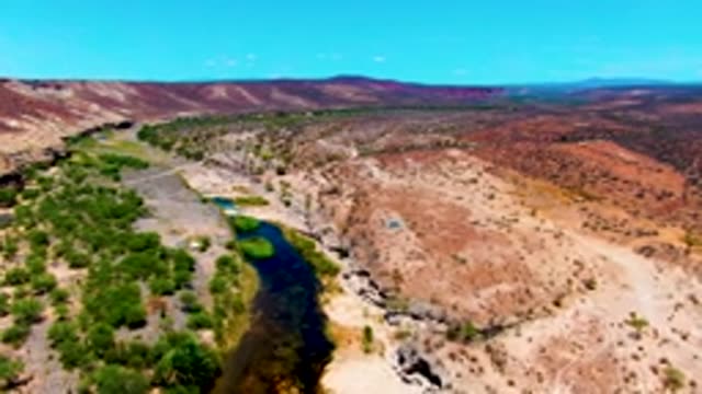 SAN JUANICO BCS MEXICO-2022: River Winding Through Arid Terrain