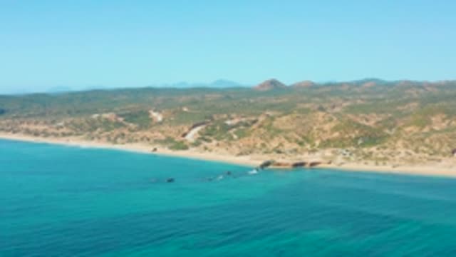 EL TULE LOS CABOS BCS MEXICO-2022: Sandy Beach and Clear Turquoise Waters by Hills