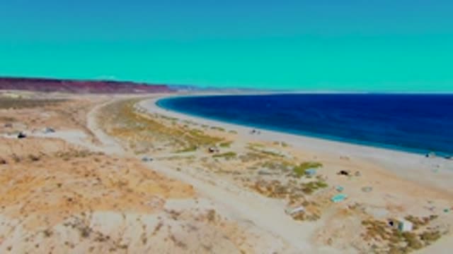 SAN JUANICO BCS MEXICO-2022: Sandy Beach Along Desert Coastline with Ocean