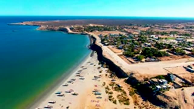 SAN JUANICO BCS MEXICO-2022: Shifting Shadow on Sandy Beach and Coastal Road