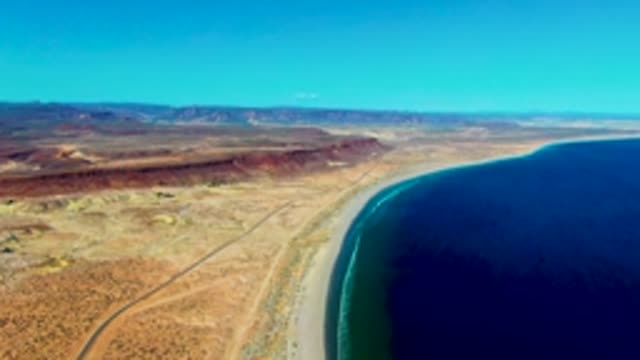 SAN JUANICO BCS MEXICO-2022: Coastal Desert with Sandy Beach and Road