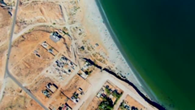 SAN JUANICO BCS MEXICO-2022: Coastal Road and Beach with Moving Vehicle