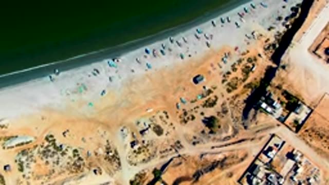 SAN JUANICO BCS MEXICO-2022: Fishing Boats on Sandy Beach Being Relocated