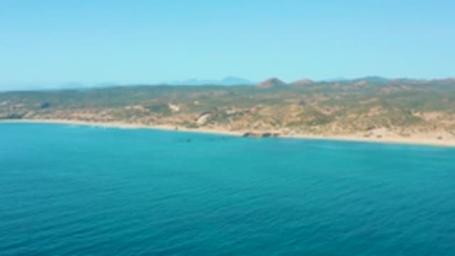 EL TULE LOS CABOS BCS MEXICO-2022: Small Boat Gliding Along the Sandy Coastline