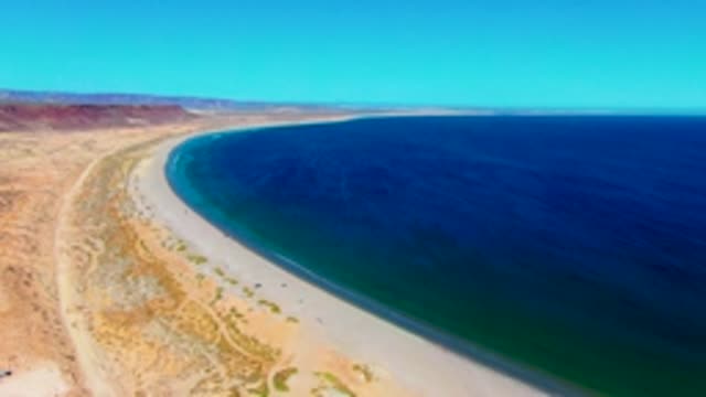 SAN JUANICO BCS MEXICO-2022: Desert Coast and Sandy Beach with Moving People