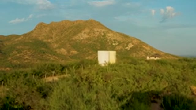 CABO PULMO LOS CABOS BCS MEXICO-2022: Aerial Transition From Road to Hillside with White Structure