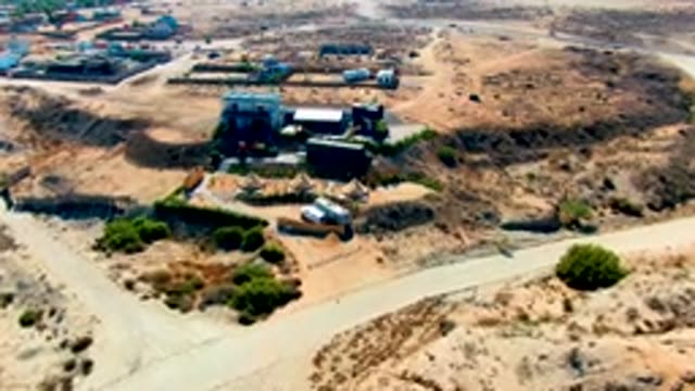 SAN JUANICO BCS MEXICO-2022: Approaching Desert Camp with Tents and Buildings