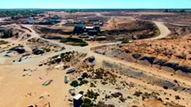 SAN JUANICO BCS MEXICO-2022: Arid Terrain with Intersecting Dirt Roads and Sparse Vegetation
