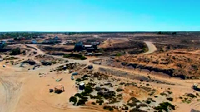 SAN JUANICO BCS MEXICO-2022: Construction Site Activity with Vehicles Moving on Dirt Roads