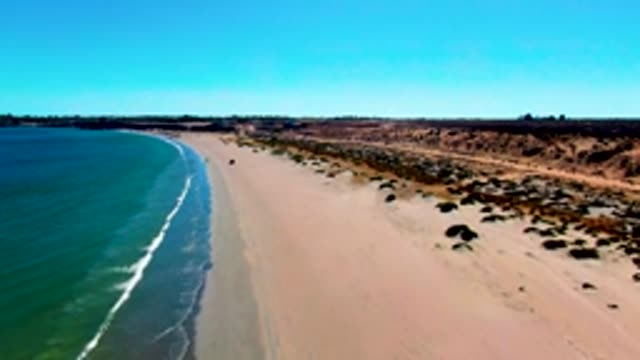 SAN JUANICO BCS MEXICO-2022: Gentle Waves Rolling Onto Sandy Beach