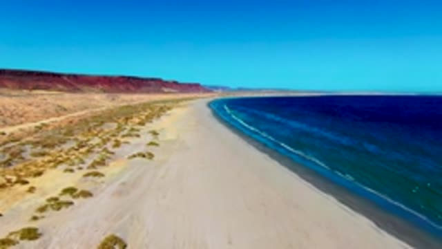 SAN JUANICO BCS MEXICO-2022: Desert Coastline with Sandy Beach and Ocean Waves